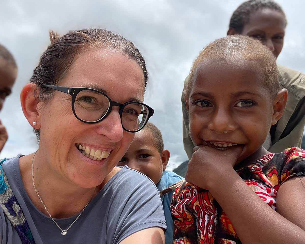 MAF PNG's Communications Officer Mandy Glass with Grace - a young girl who was medevaced by MAF six years ago