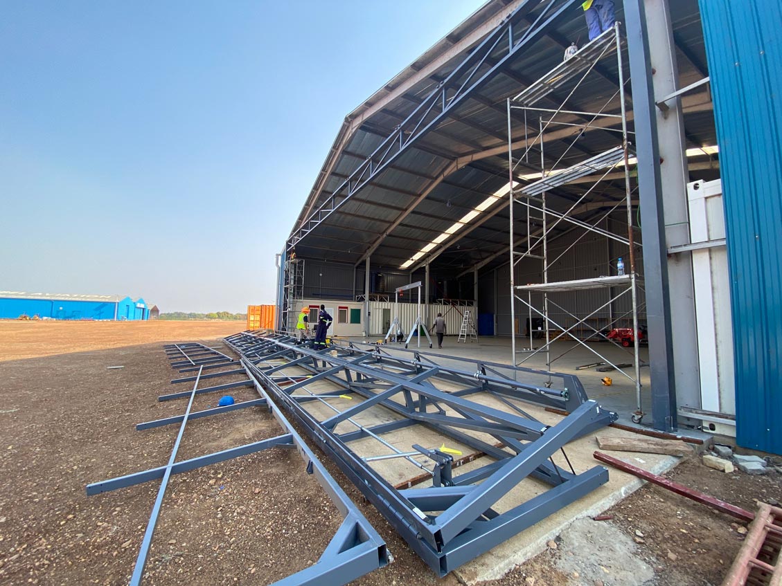 The construction of massive hangar doors preparing to be attached to MAF South Sudan's hangar